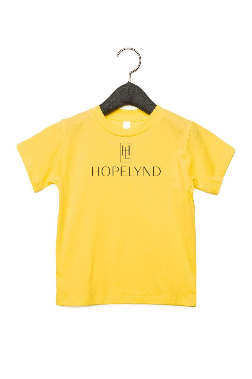 Yellow Hopelynd Logo Toddler Tee with black logo